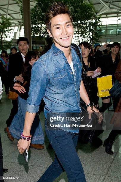 Choi Si-Won of South Korean boy band Super Junior is seen on departure at Incheon International Airport on March 8, 2013 in Incheon, South Korea.