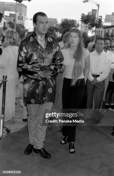 Steven Seagal and Arissa Wolf attend the local premiere of "Conspiracy Theory" at the Mann Village Theatre in the Westwood neighborhood of Los...