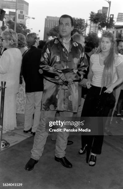 Steven Seagal and Arissa Wolf attend the local premiere of "Conspiracy Theory" at the Mann Village Theatre in the Westwood neighborhood of Los...