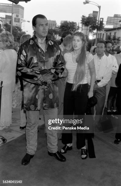 Steven Seagal and Arissa Wolf attend the local premiere of "Conspiracy Theory" at the Mann Village Theatre in the Westwood neighborhood of Los...