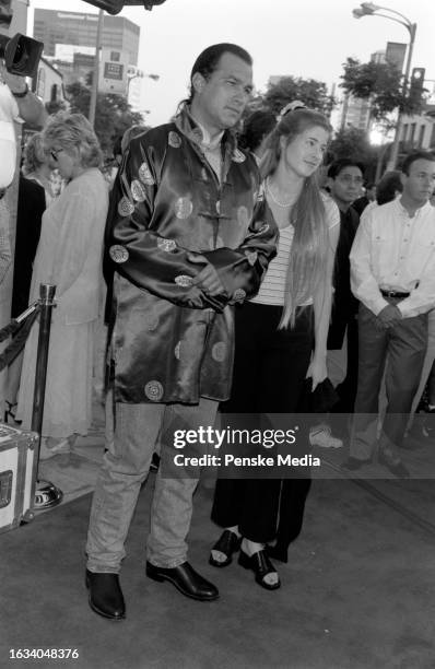 Steven Seagal and Arissa Wolf attend the local premiere of "Conspiracy Theory" at the Mann Village Theatre in the Westwood neighborhood of Los...