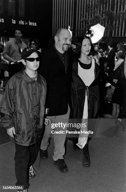 Max Minghella, Anthony Minghella, and Carolyn Choa attend the local premiere of "Cop Land" at the Ziegfeld Theatre in New York City on August 6, 1997.