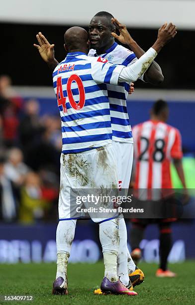 Stephane Mbia of Queens Park Rangers and Christopher Samba of Queens Park Rangers celebrate victory during the Barclays Premier League match between...