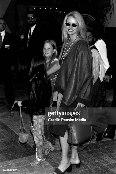 Donna Dixon, with daughters Belle Aykroyd and Danielle Aykroyd, attend the local premiere of "The Lost World: Jurassic Park" at Cineplex Odeon...