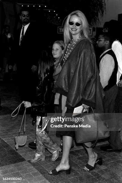 Donna Dixon, with daughters Belle Aykroyd and Danielle Aykroyd, attend the local premiere of "The Lost World: Jurassic Park" at Cineplex Odeon...