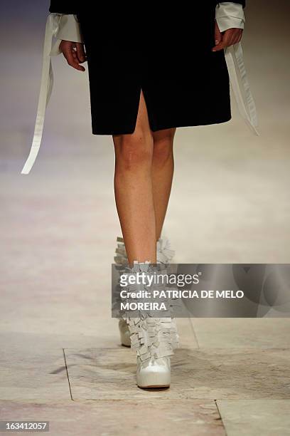 Model displays an outfit by Serbian fashion designer Aleksandar Protic of the Autumn/Winter 2013-2014 collection during the 40th edition of the Moda...