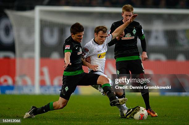 Aleksandar Ignjovski of Bremen challenges Tony Jantschke of Moenchengladbach during the Bundesliga match between VfL Borussia Moenchengladbach and SV...