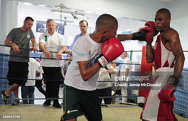 Laureus Academy member Sean Fitzpatrick watches a boxing demonstration by local children during the Luta Pela Paz Project visit at Complexo de Mare...