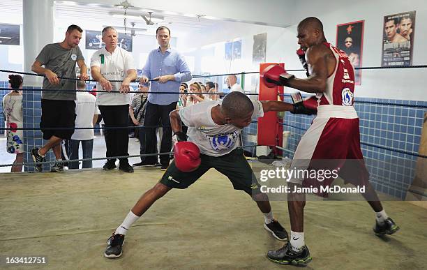 Laureus Academy member Sean Fitzpatrick watches a boxing demonstration by local children during the Luta Pela Paz Project visit at Complexo de Mare...