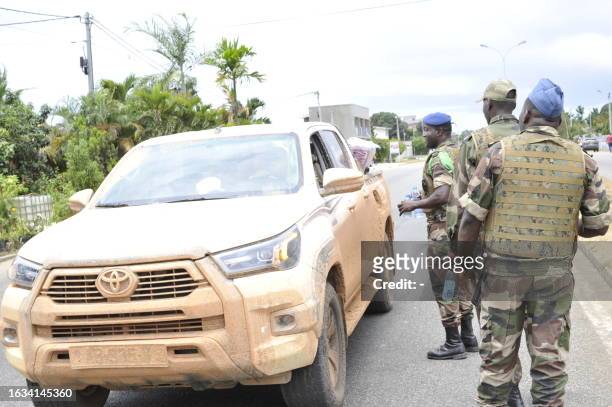 Gabonese security forces are seen in Libbreville on August 30, 2023 after a group of Gabonese military officers appeared on television announcing...