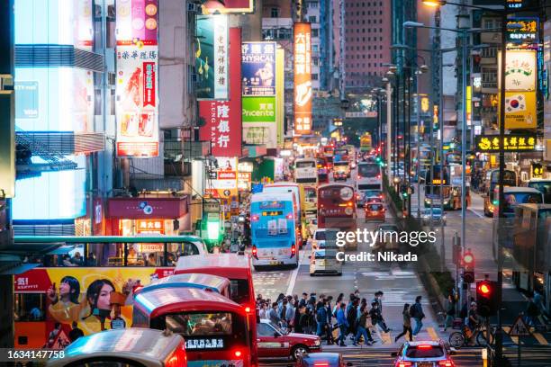 crowded street and crosswalk in nathan road, hong kong - central stock pictures, royalty-free photos & images