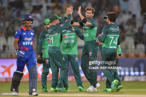 Pakistan's Shaheen Shah Afridi celebrates with teammates after taking the wicket of Nepal's captain Rohit Paudel during the Asia Cup 2023 cricket...