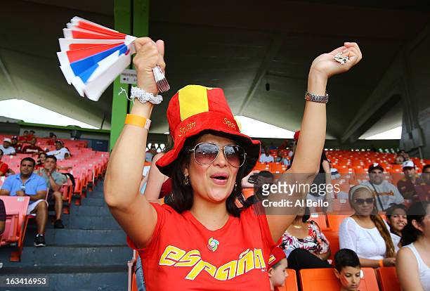 Fan of Spain cheers on her team against the Dominican Republic during the first round of the World Baseball Classic at Hiram Bithorn Stadium on March...