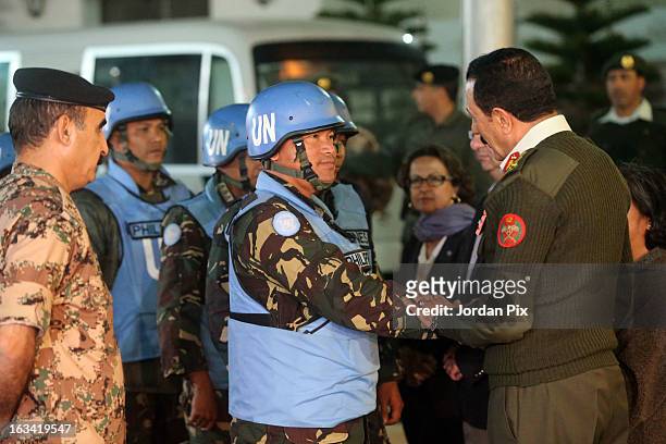 Chief of Staff Mishaal al Zaben greets the Twenty-one Filipino UN peacekeepers who were held hostage at the free Syrian army in Golan as they arrive...