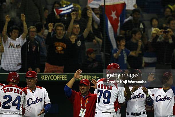 Infielder Jose Abreu of Cuba celerates after scoring during the World Baseball Classic Second Round Pool 1 game between Chinese Taipei and Cuba at...