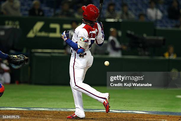 Outfielder Guillermo Heredia of Cuba is hit with a pitch during the World Baseball Classic Second Round Pool 1 game between Chinese Taipei and Cuba...