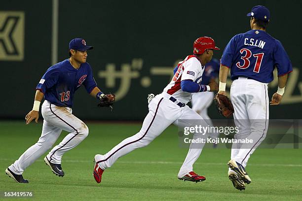 Infielder Erisbel Arruebarruena of Cuba is chased down during the World Baseball Classic Second Round Pool 1 game between Chinese Taipei and Cuba at...