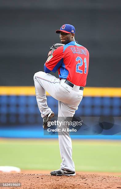 Samuel Deduno of the Dominican Republic pitches against Spain during the first round of the World Baseball Classic at Hiram Bithorn Stadium on March...