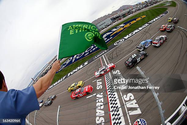 Brian Vickers, driver of the Dollar General Toyota, leads the field past the green flag to start the NASCAR Nationwide Series Sam's Town 300 at Las...