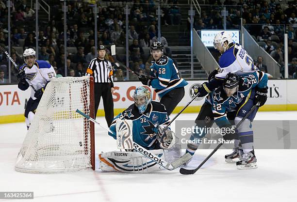Patrik Berglund of the St. Louis Blues gets the puck past Dan Boyle and goalie Alex Stalock of the San Jose Sharks to score the game-winning goal in...