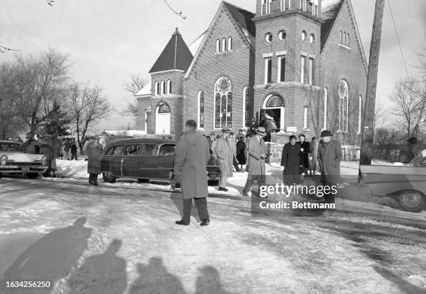 The casket bearing the body of Bernice Worden is carried from the Plainfield Methodist Church after her funeral services. It was announced the same...