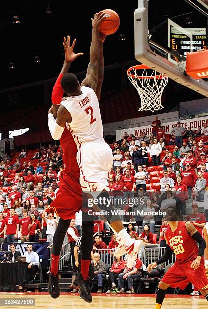 Guard Mike Ladd of the Washington State Cougars makes a goal attempt during the first half of the game against the USC Trojans at Beasley Coliseum on...