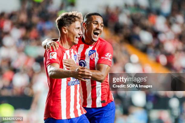 Marcos Llorente of Atletico de Madrid and Lino of Atletico de Madrid celebrates a goal during the LaLiga EA Sports 2023/24 match between Rayo...