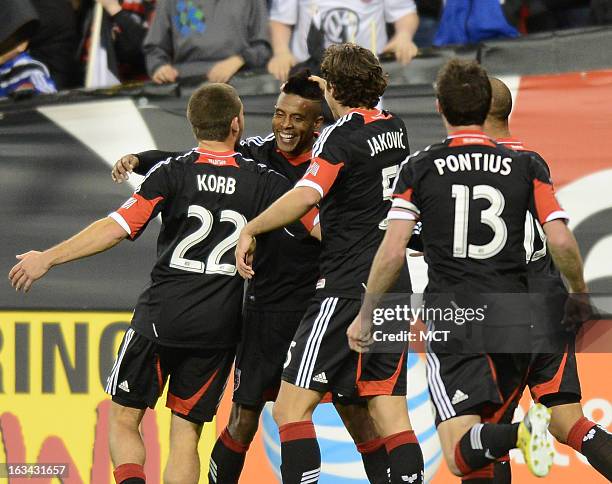 United forward Lionard Pajoy celebrates with teammates following his goal against Real Salt Lake in the second half at RFK Stadium in Washington,...