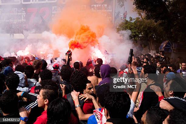 Members and supporters of Cairo, Egypt's football club Ultras Al-Ahly celebrate on Saturday, March 9 following the Egyptian court's verdict in the...