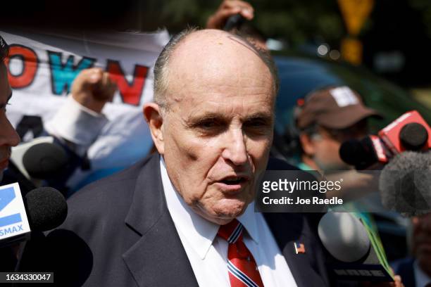 Rudy Giuliani speaks to the media after leaving the Fulton County jail on August 23, 2023 in Atlanta, Georgia. Giuliani is one of 19, including...