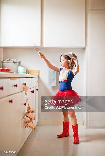 kitchen warrior - red dress child stock-fotos und bilder