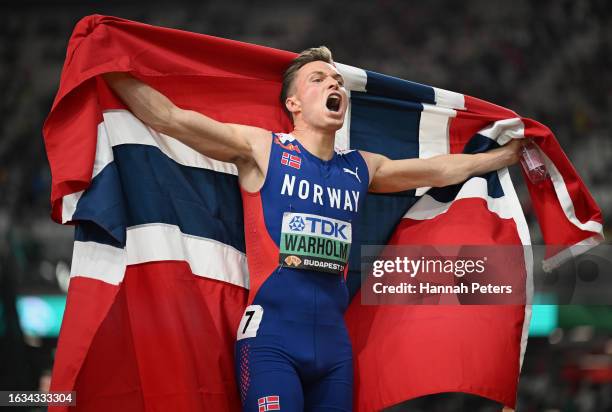 Karsten Warholm of Team Norway celebrates winning the Men's 400m Hurdles Final during day five of the World Athletics Championships Budapest 2023 at...