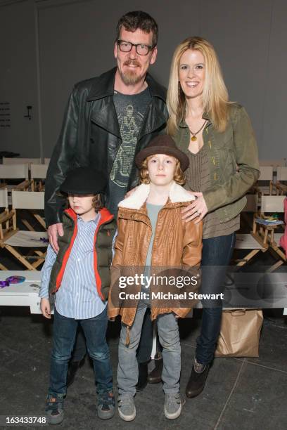 Personalities Simon van Kempen and Alex McCord with children attend the Diesel Kids fashion show during 2013 petitePARADE Kids Fashion Week at...