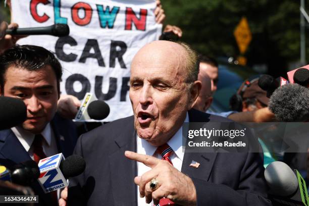 Rudy Giuliani speaks to the media after leaving the Fulton County jail on August 23, 2023 in Atlanta, Georgia. Giuliani is one of 19, including...