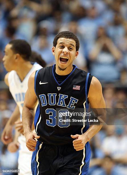 Seth Curry of the Duke Blue Devils reacts after making a basket against the North Carolina Tar Heels during their game at the Dean E. Smith Center on...
