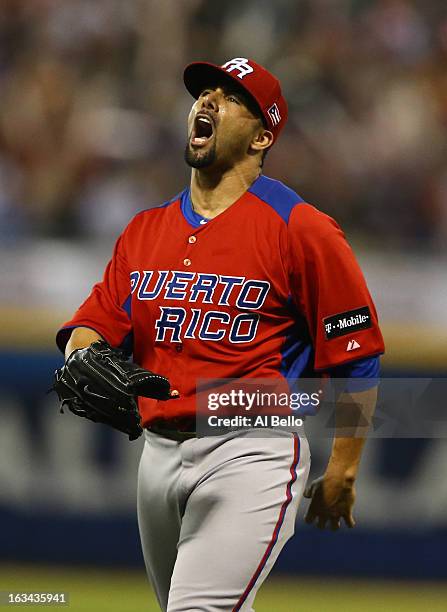 Romero of Puerto Rico celebrates after retiring the side after the eighth inning against Venezuela during the first round of the World Baseball...