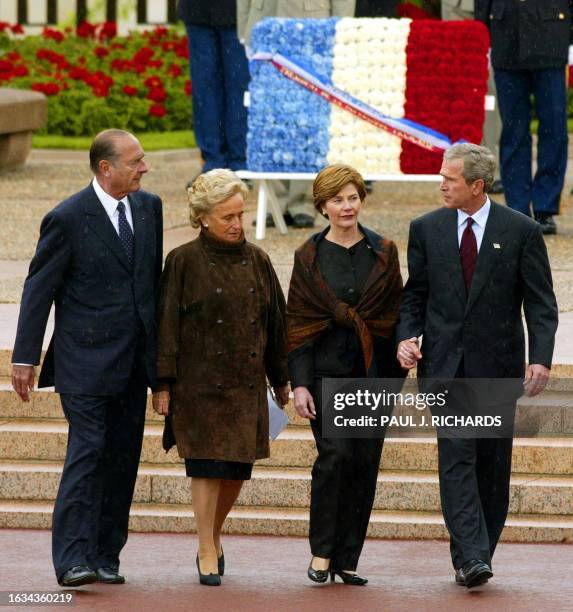 French President Jacques Chirac , his wife Bernadette , US President George W. Bush and his wife Laura leave the World War II Normandy American...