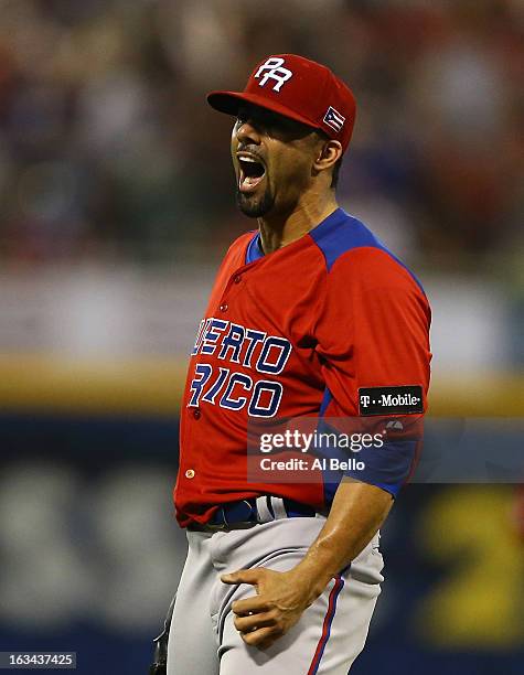 Romero of Puerto Rico celebrates after retiring the side after the eighth inning against Venezuela during the first round of the World Baseball...