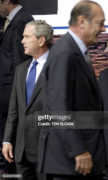 President George W. Bush and French President Jacques Chirac take their places for the "class photo" after the opening session of the NATO Summit 28...