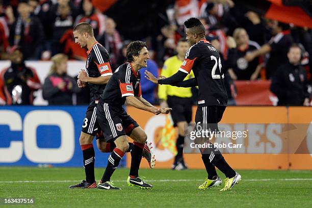 Lionard Pajoy of D.C. United celebrates his second half goal with teammate John Thorrington against the Real Salt Lake at RFK Stadium on March 9,...