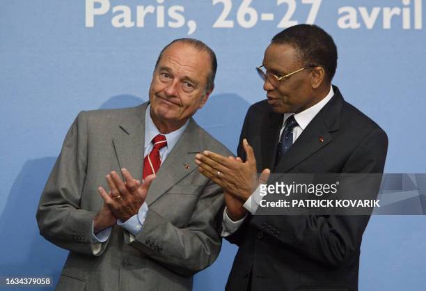 French President Jacques Chirac listens to his Niger counterpart Mamadou Tandja during a summit on managing the resources of West Africa's Niger...