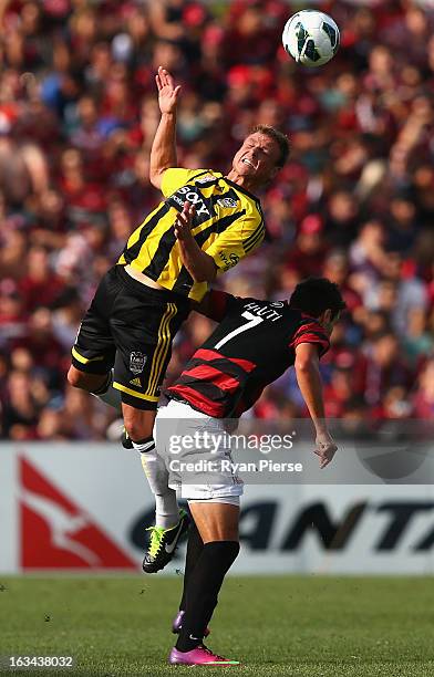 Ben Sigmund of the Phoenix competes for the ball against Labinot Haliti of the Wanderers during the round 24 A-League match between the Western...