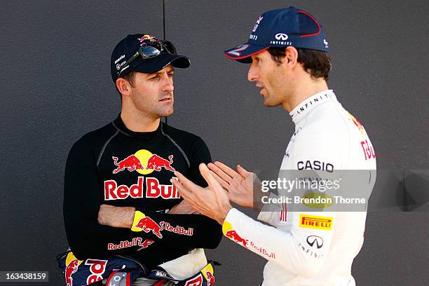 Mark Webber of Australia and Infiniti Red Bull Racing and Jamie Whincup of Red Bull Racing Australia Holden speak during the Top Gear Festival at...