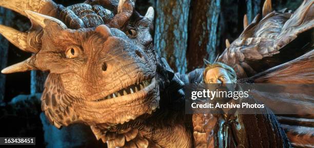 Dennis Quaid and dragon looking up in a scene from the film 'DragonHeart', 1996.