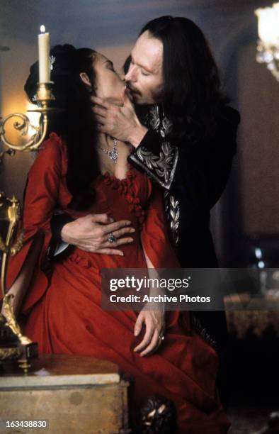 Winona Ryder and Gary Oldman kiss in a scene from the film 'Dracula', 1992.