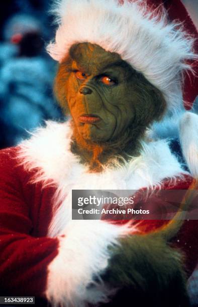 Jim Carrey with arms crossed in a scene from the film 'How The Grinch Stole Christmas', 2000.