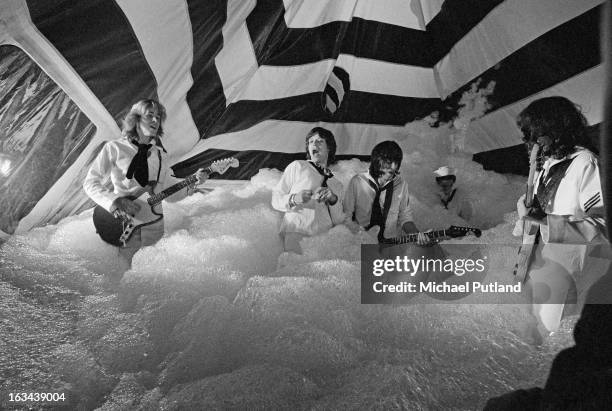 The Rolling Stones pose during the production of their music video for 'It's Only Rock 'n Roll ' in June 1974 in London, England. The video was...