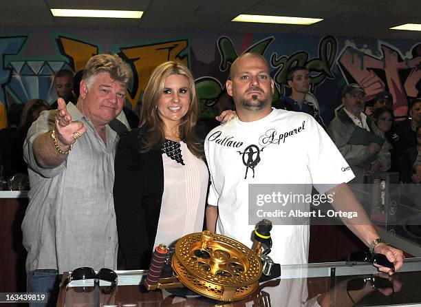 Personalities Dan Dotson, Brandi Passante and Jarrod Schulz attend the "Storage Wars" Cast Store Opening held at Now & Then Second Hand Store on...