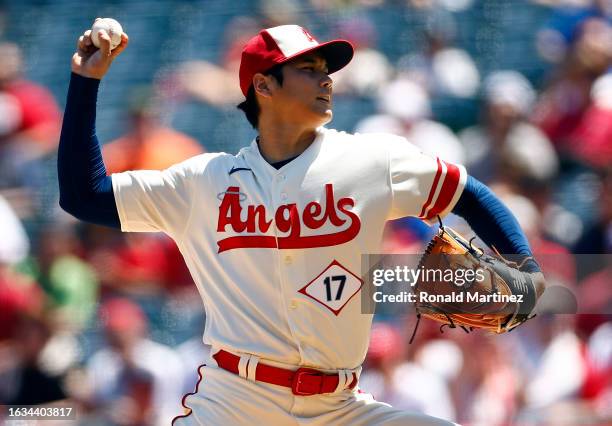 Shohei Ohtani of the Los Angeles Angels throws against the Cincinnati Reds in the first inning during game one of a doubleheader at Angel Stadium of...