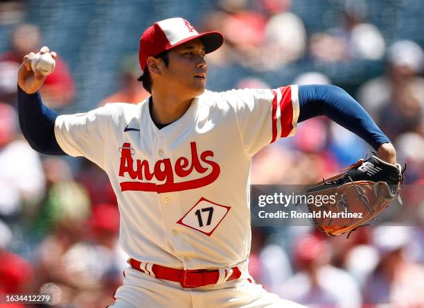 Shohei Ohtani of the Los Angeles Angels throws against the Cincinnati Reds in the first inning during game one of a doubleheader at Angel Stadium of...